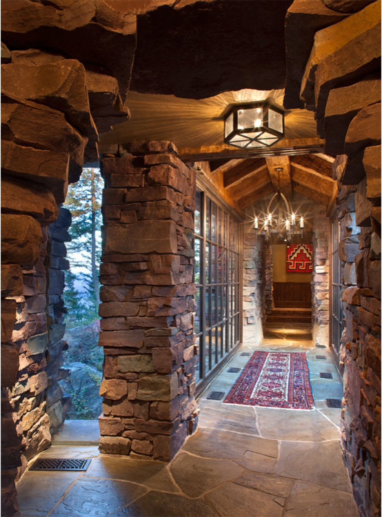Inspiration for a large country hallway in Other with slate floors.