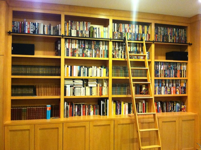 library cabinets with rolling library ladder - modern - basement