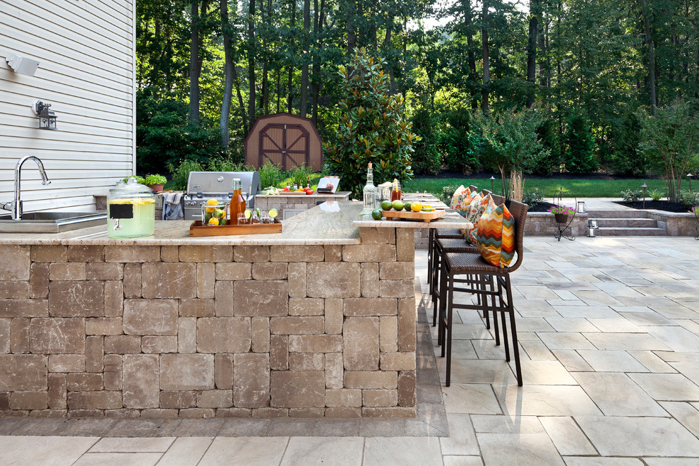 Example of a mid-sized mountain style backyard patio design