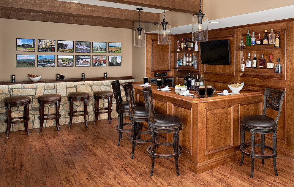 Inspiration for a mid-sized country l-shaped seated home bar in DC Metro with an undermount sink, dark wood cabinets, wood benchtops, medium hardwood floors, brown splashback, timber splashback, brown floor and brown benchtop.