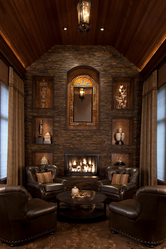 Inspiration for a traditional family room in Chicago with a stone fireplace surround.