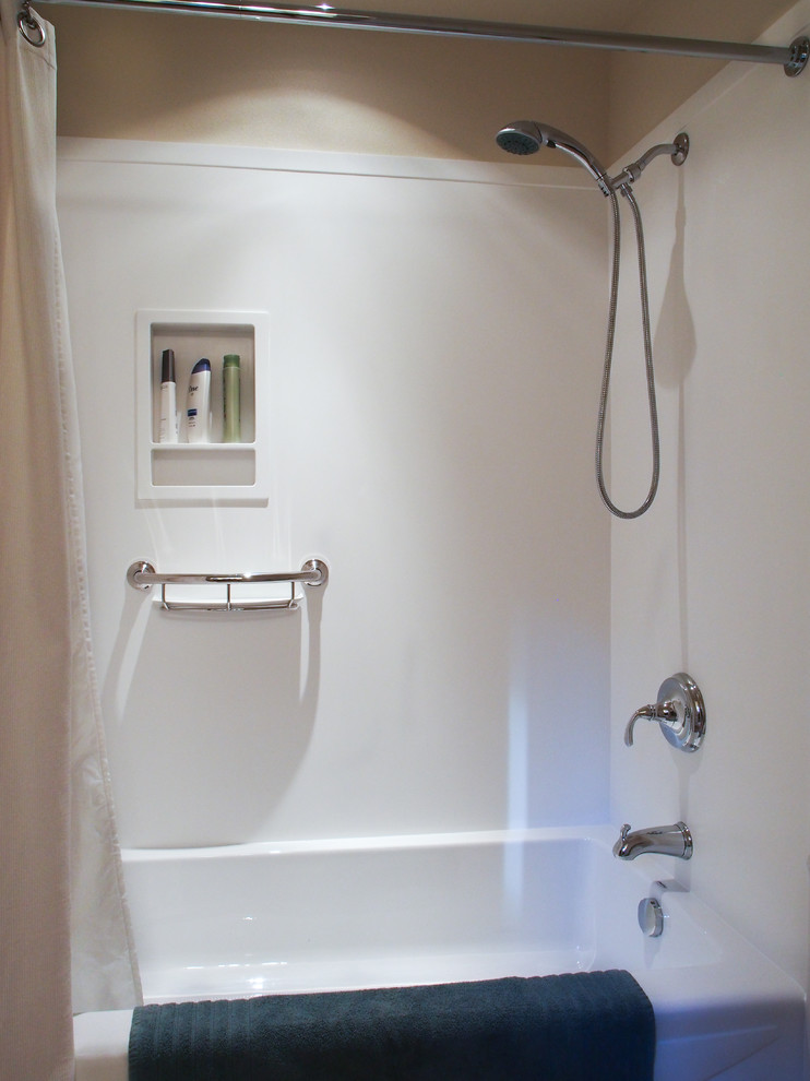 Example of a mid-sized transitional 3/4 linoleum floor, brown floor and single-sink alcove bathtub design in Seattle with a drop-in sink, recessed-panel cabinets, dark wood cabinets, solid surface countertops, a two-piece toilet, white walls, beige countertops and a built-in vanity