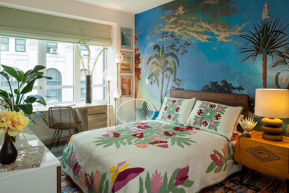 This is an example of a mid-sized tropical guest bedroom in New York with multi-coloured walls and no fireplace.
