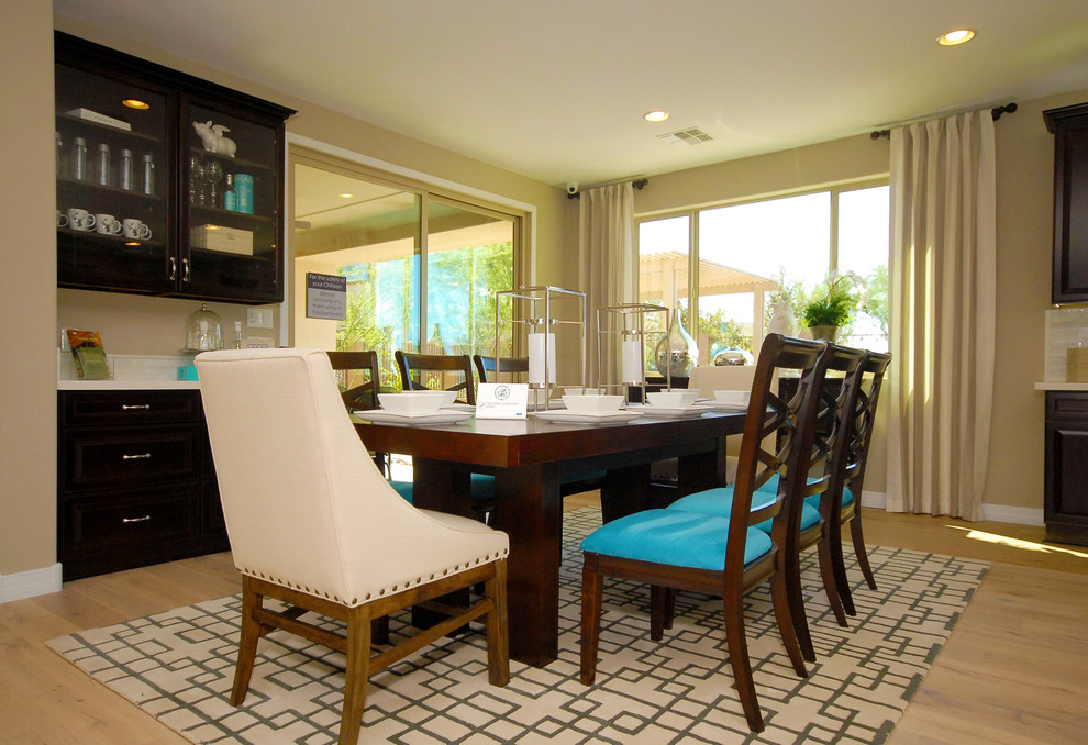 Inspiration for an expansive contemporary open plan dining in Phoenix with beige walls and light hardwood floors.