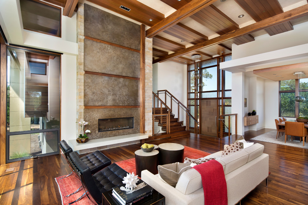 This is an example of a contemporary formal open concept living room in San Francisco with white walls, medium hardwood floors, no tv, a ribbon fireplace and a metal fireplace surround.