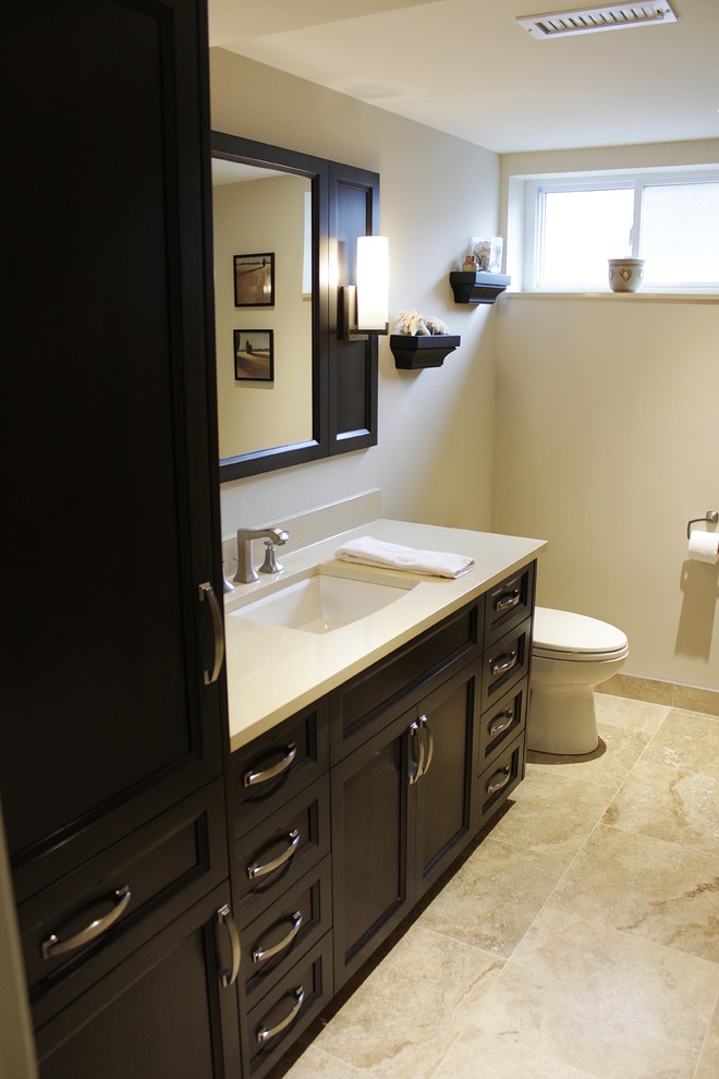 Photo of a small transitional bathroom in Toronto with an undermount sink, shaker cabinets, black cabinets, engineered quartz benchtops, an alcove tub, an open shower, a one-piece toilet, beige tile, ceramic tile, beige walls and ceramic floors.