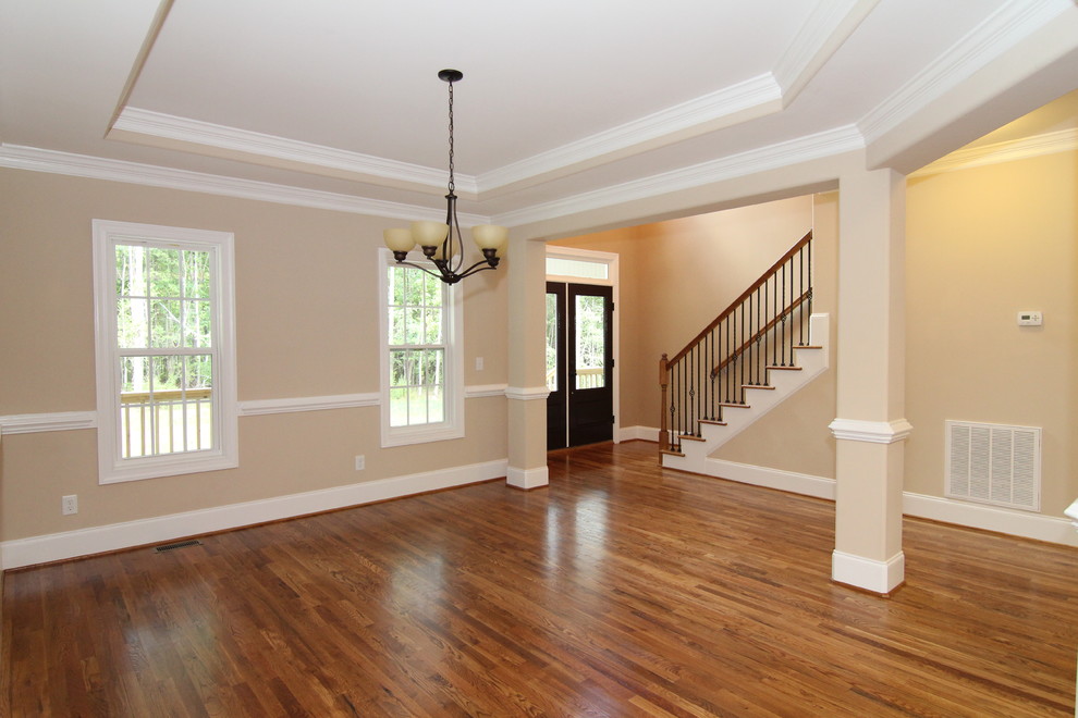 Inspiration for a large country light wood floor great room remodel in Raleigh with beige walls
