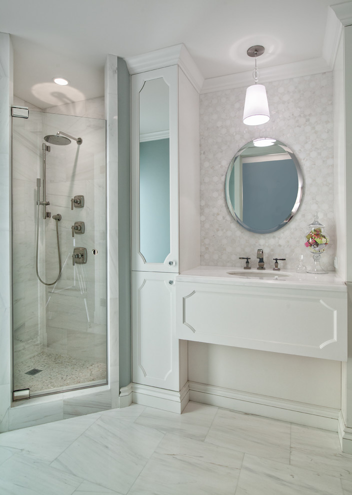 Inspiration for a large contemporary master bathroom in Miami with an undermount sink, white cabinets, a corner shower, white tile, white walls, recessed-panel cabinets, marble, marble floors, marble benchtops, white floor, a hinged shower door and white benchtops.