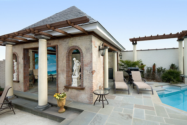 Photo of a mid-sized mediterranean backyard custom-shaped pool in Other with a water feature.