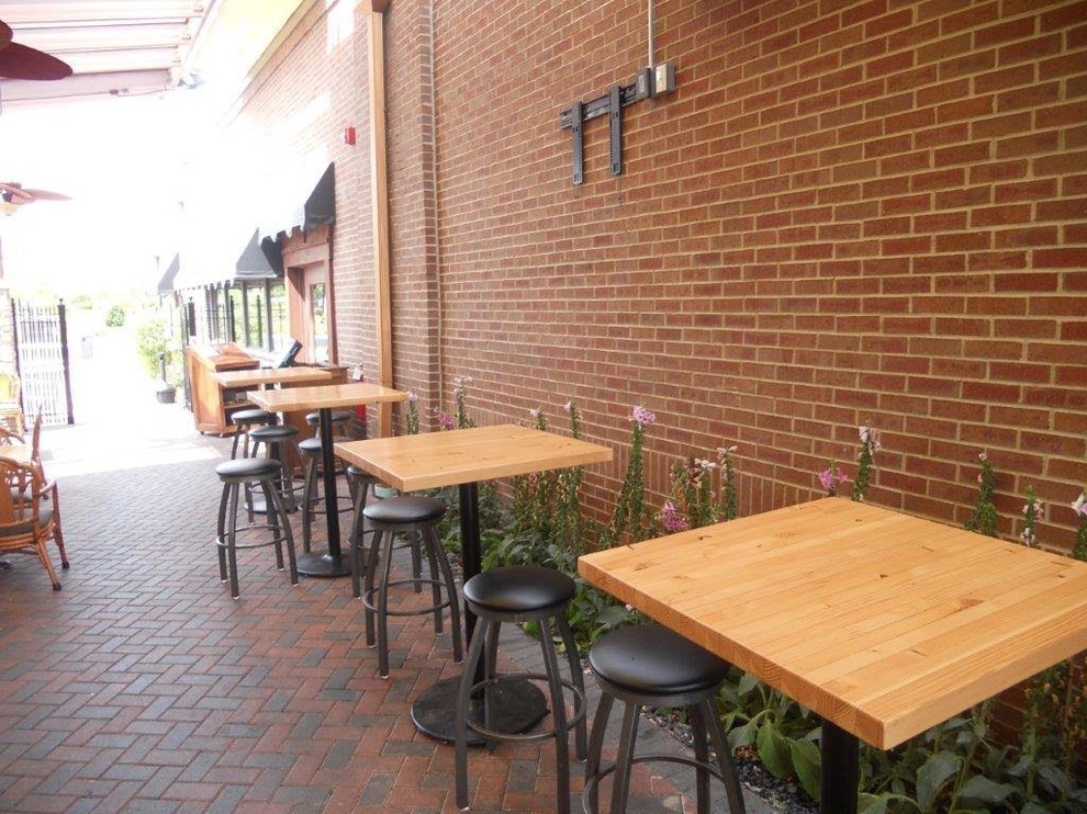 Patio - large transitional backyard brick patio idea in Chicago with no cover