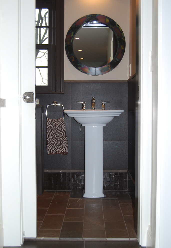 Inspiration for a small eclectic powder room in Boston with brown tile, porcelain tile, purple walls, marble floors, a pedestal sink and brown floor.