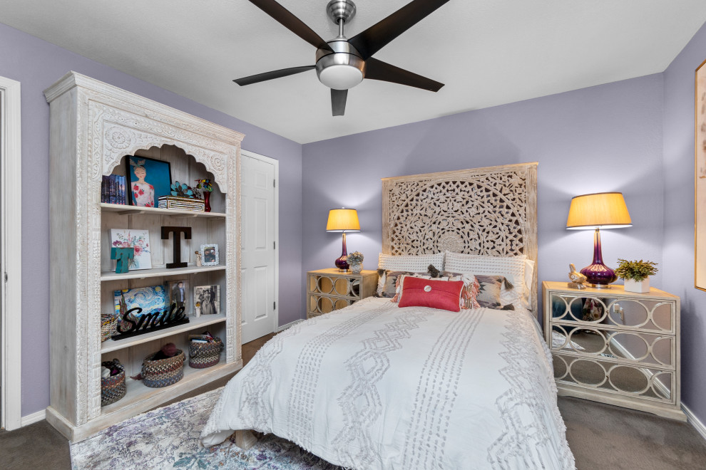 Inspiration for a mid-sized transitional bedroom in St Louis with purple walls, carpet and beige floor.