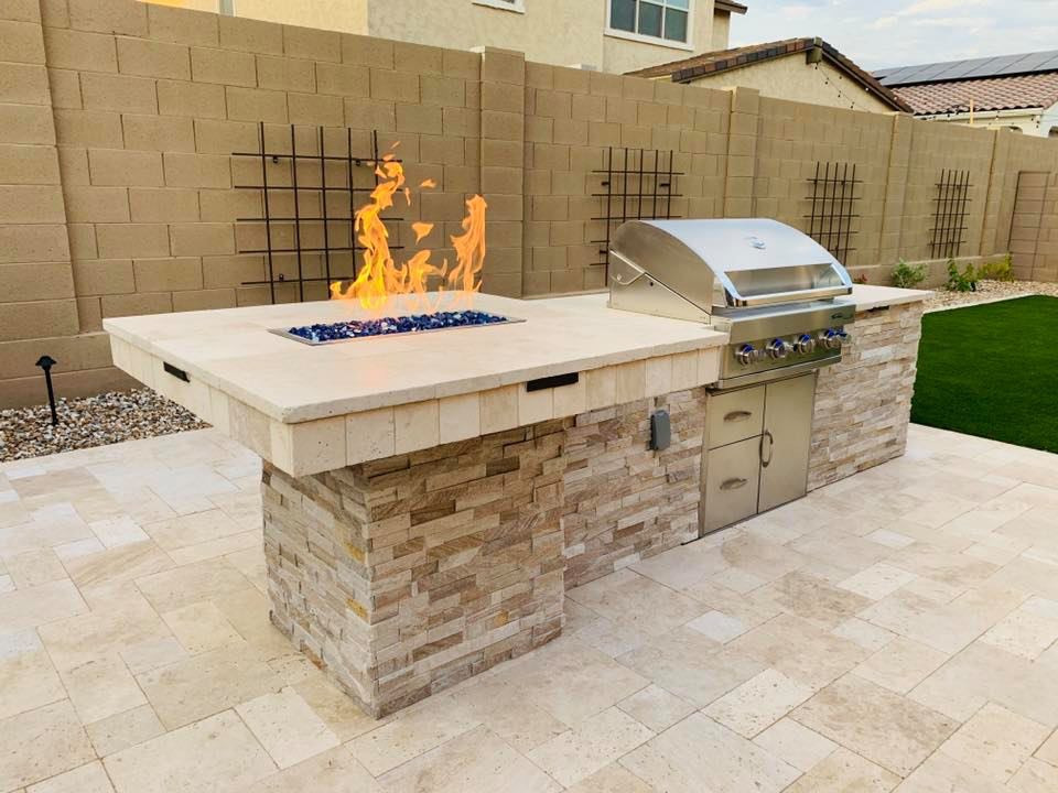 Design ideas for a large modern backyard patio in Phoenix with a fire feature and brick pavers.