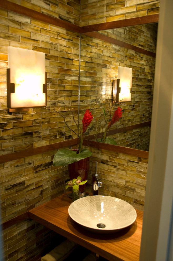 Design ideas for a small contemporary powder room in Dallas with a vessel sink and glass tile.