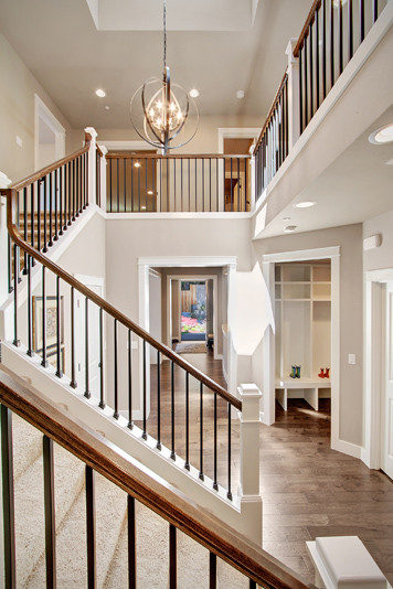Mid-sized transitional carpeted l-shaped staircase in Seattle with carpet risers.