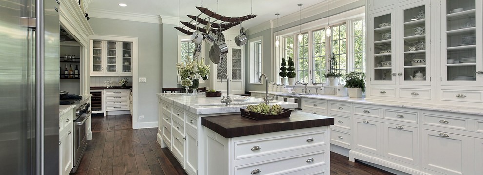 Large transitional galley medium tone wood floor and brown floor eat-in kitchen photo in Phoenix with an undermount sink, shaker cabinets, white cabinets, marble countertops, stainless steel appliances and an island