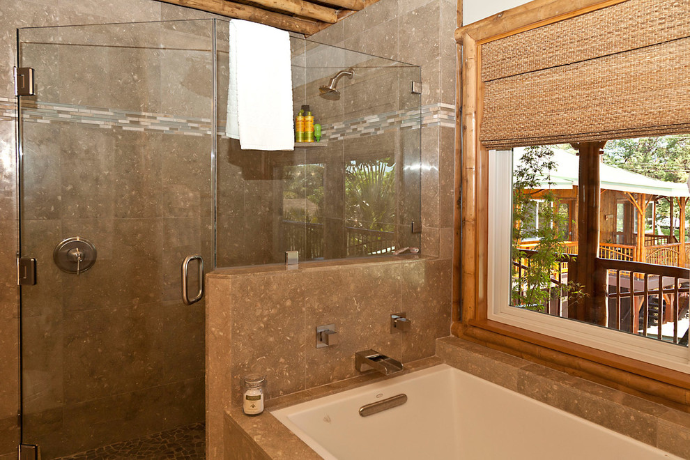This is an example of a tropical master bathroom in Hawaii with a vessel sink, a drop-in tub, an alcove shower and white walls.