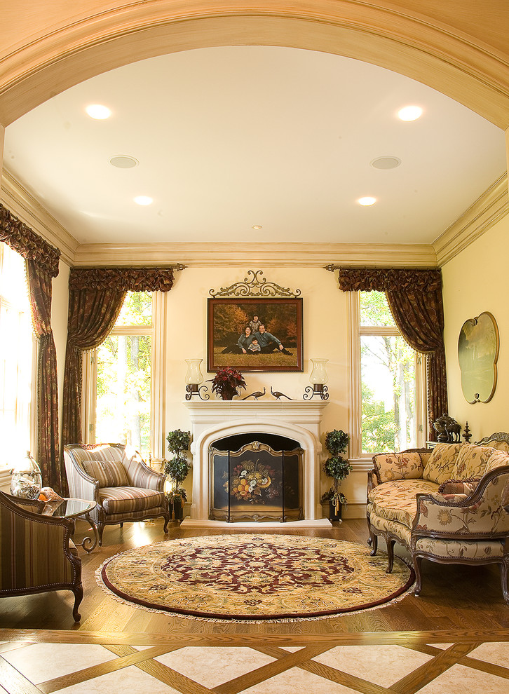 Design ideas for a traditional living room in Baltimore with beige walls and a standard fireplace.