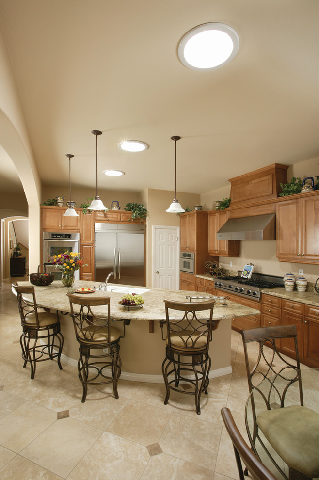 Inspiration for a traditional eat-in kitchen in Oklahoma City with medium wood cabinets, granite benchtops, stainless steel appliances, ceramic floors and with island.
