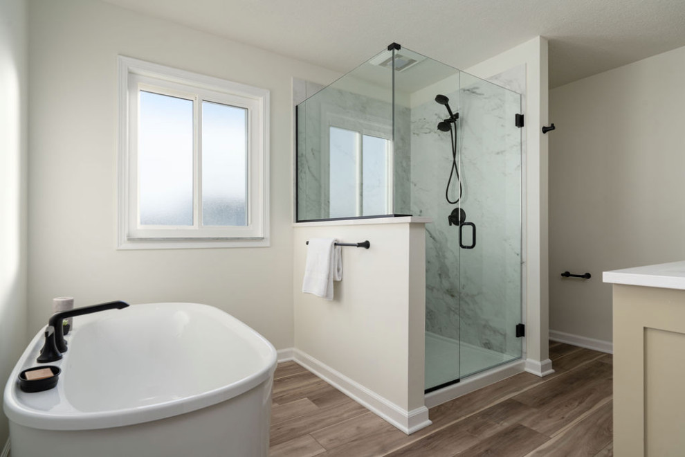 Example of a large transitional master multicolored tile and porcelain tile vinyl floor, brown floor and double-sink alcove shower design in Columbus with recessed-panel cabinets, green cabinets, a one-piece toilet, white walls, an undermount sink, quartz countertops, a hinged shower door, white countertops and a built-in vanity