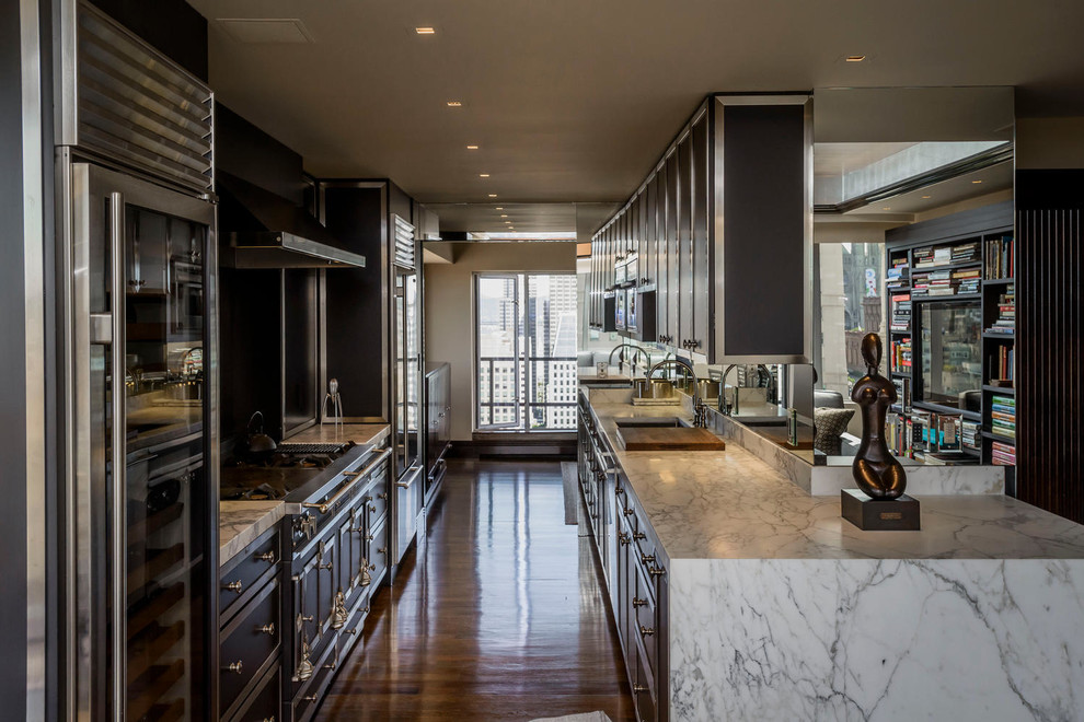 Design ideas for a large contemporary galley eat-in kitchen in San Francisco with an undermount sink, raised-panel cabinets, black cabinets, marble benchtops, white splashback, stone slab splashback, stainless steel appliances, medium hardwood floors and no island.