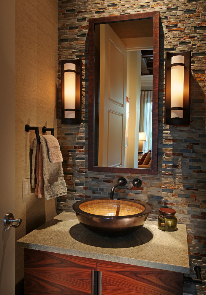 This is an example of a transitional powder room in Miami with a vessel sink, flat-panel cabinets, dark wood cabinets, multi-coloured tile, slate and grey benchtops.