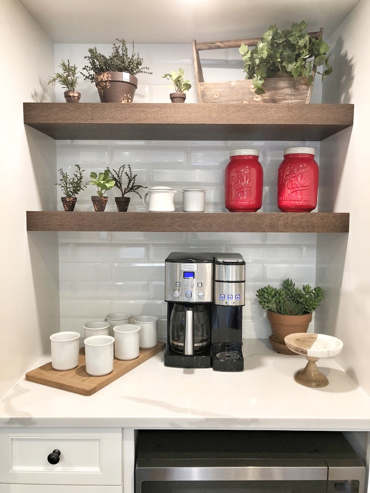 Eat-in kitchen - huge transitional dark wood floor and brown floor eat-in kitchen idea with an undermount sink, shaker cabinets, white cabinets, quartz countertops, white backsplash, porcelain backsplash, stainless steel appliances, an island and white countertops