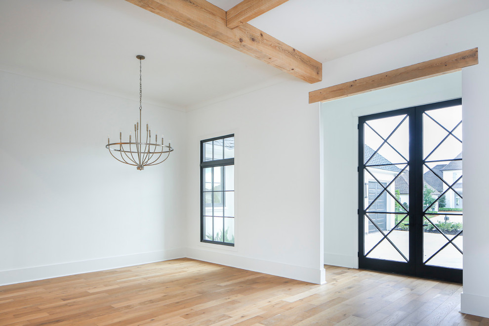 Photo of a contemporary dining room in Other with white walls, light hardwood floors and exposed beam.