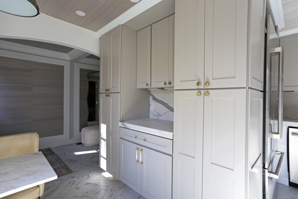 Inspiration for a mid-sized transitional l-shaped marble floor, white floor and exposed beam kitchen remodel in DC Metro with an undermount sink, shaker cabinets, white cabinets, quartzite countertops, white backsplash, quartz backsplash and stainless steel appliances