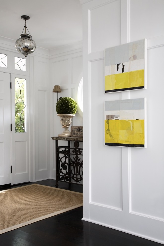 Design ideas for a transitional entryway in Los Angeles with white walls and dark hardwood floors.