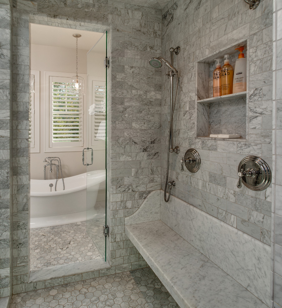 Design ideas for a mid-sized beach style master wet room bathroom in Detroit with a freestanding tub, grey walls, marble floors, an undermount sink, recessed-panel cabinets, grey cabinets, marble benchtops and a shower seat.