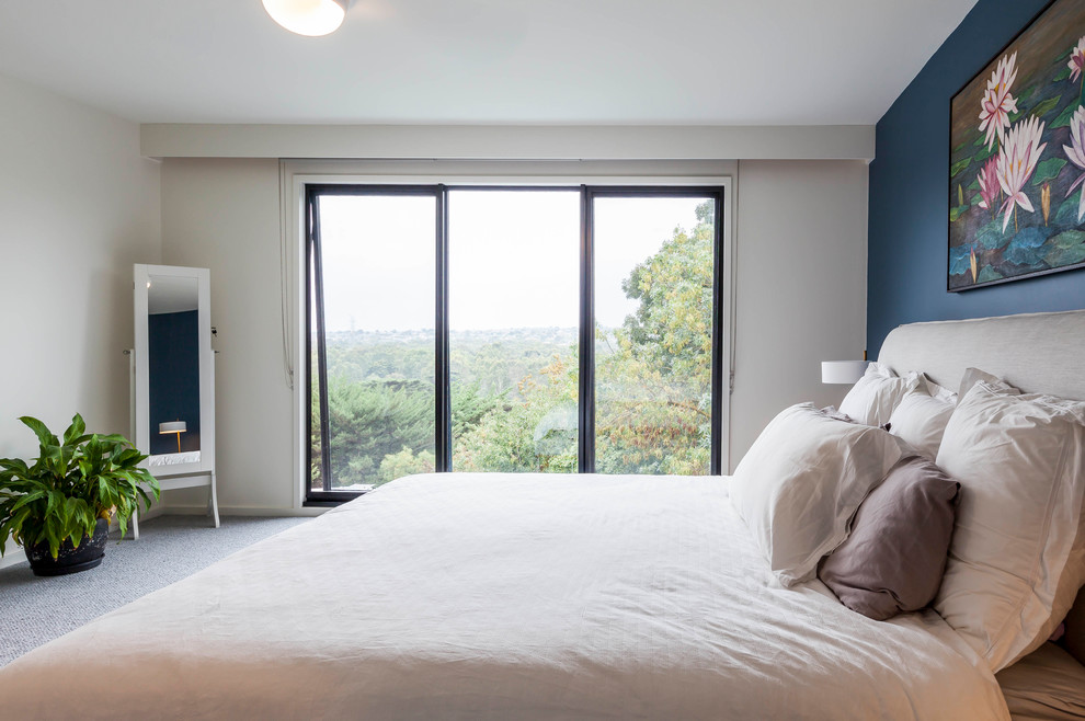 Inspiration for a large midcentury master bedroom in Melbourne with white walls, carpet and grey floor.