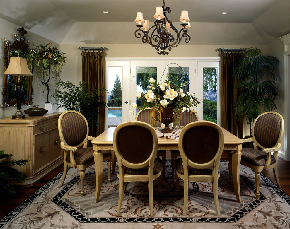 Inspiration for a traditional dining room in San Francisco with beige walls and dark hardwood floors.