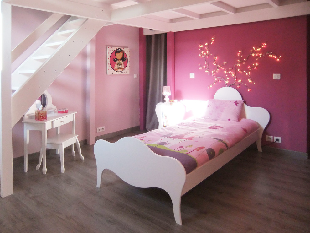 Large contemporary kids' bedroom in Other with pink walls, laminate floors and grey floor for kids 4-10 years old and girls.