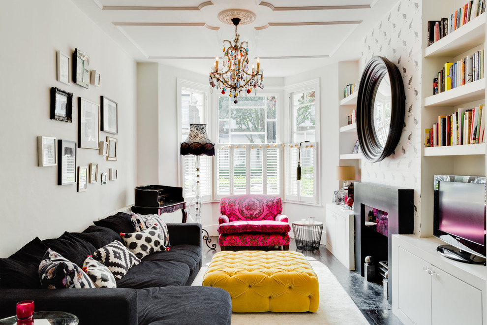 Eclectic living room in London with white walls and a standard fireplace.