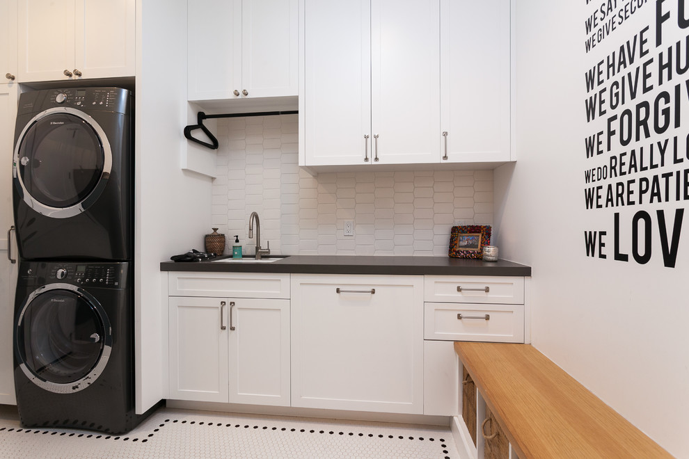 Photo of a country laundry room in Orange County with black benchtop.