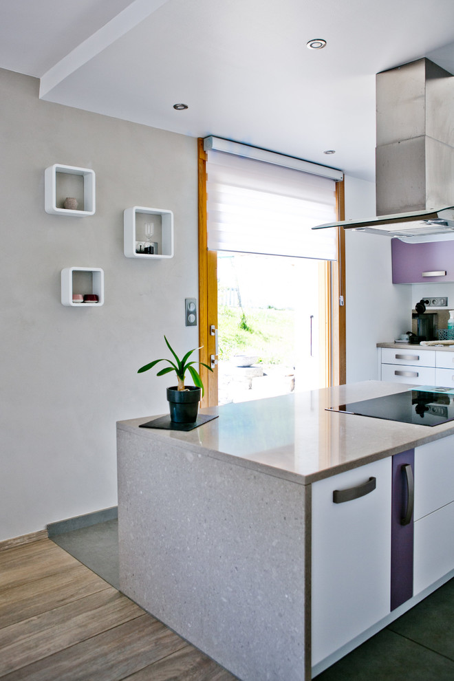 Large scandinavian l-shaped eat-in kitchen in Other with an undermount sink, flat-panel cabinets, white cabinets, granite benchtops, beige splashback, stone slab splashback, panelled appliances, ceramic floors, with island, grey floor and beige benchtop.