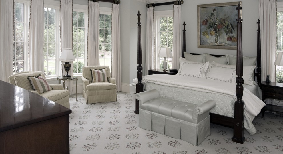Photo of a traditional bedroom in Atlanta with grey walls and carpet.