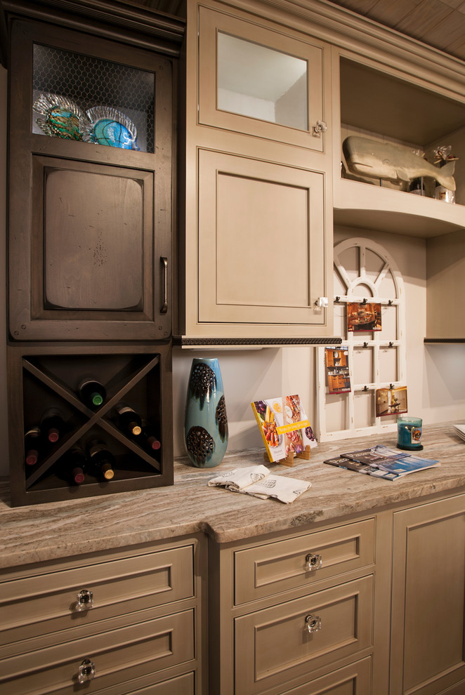 Example of a mid-sized transitional single-wall ceramic tile and brown floor eat-in kitchen design with beaded inset cabinets, beige cabinets, quartzite countertops, beige backsplash and an island