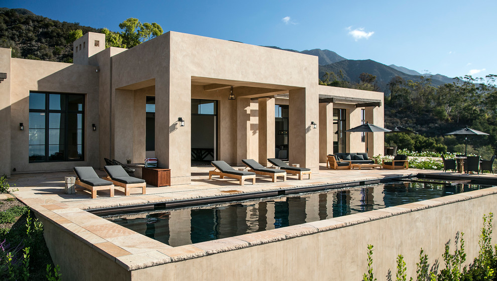 Large contemporary backyard rectangular lap pool in Santa Barbara with a hot tub and tile.