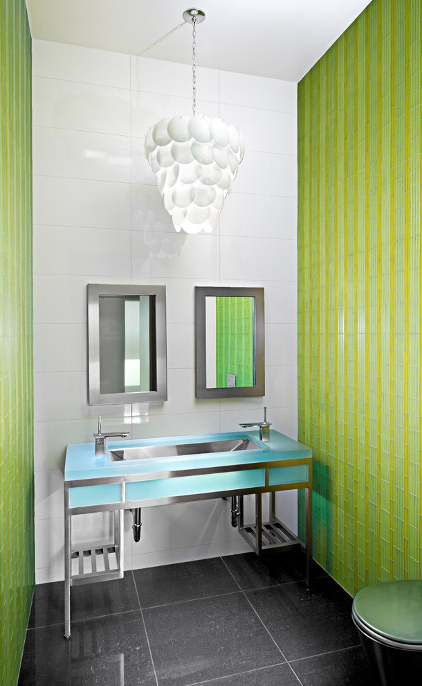 This is an example of a contemporary powder room in Las Vegas with blue benchtops.