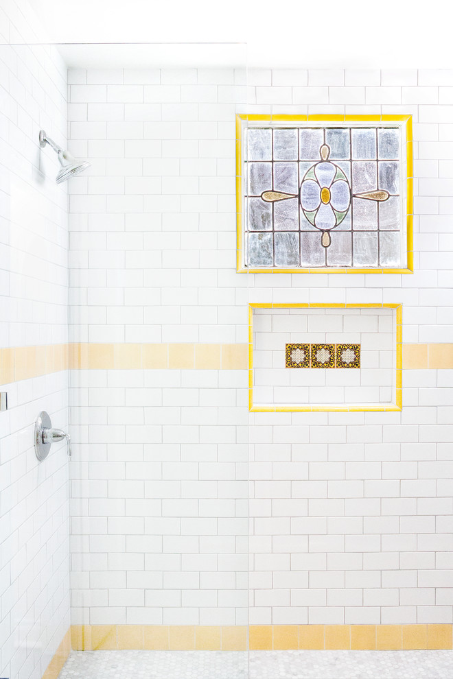 This is an example of a large country master bathroom in Los Angeles with a double shower, marble floors, white tile, subway tile, a hinged shower door and a niche.