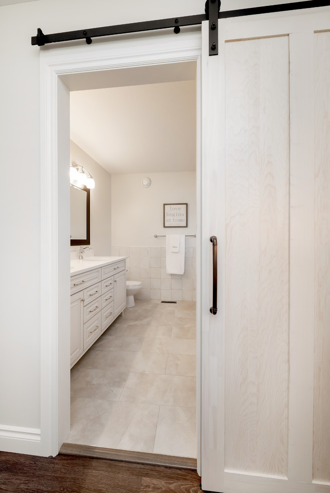 Inspiration for a small traditional master bathroom in Other with shaker cabinets, white cabinets, a drop-in tub, an open shower, white tile, porcelain tile, porcelain floors, an undermount sink, quartzite benchtops, white floor, a hinged shower door and white benchtops.