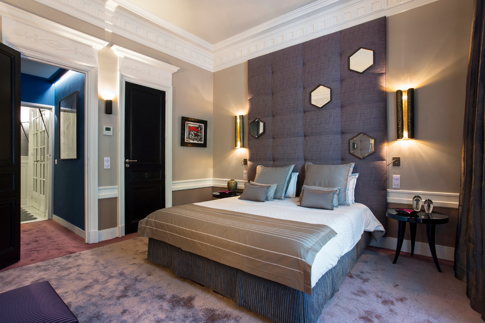 Transitional bedroom in Paris with beige walls, carpet and purple floor.