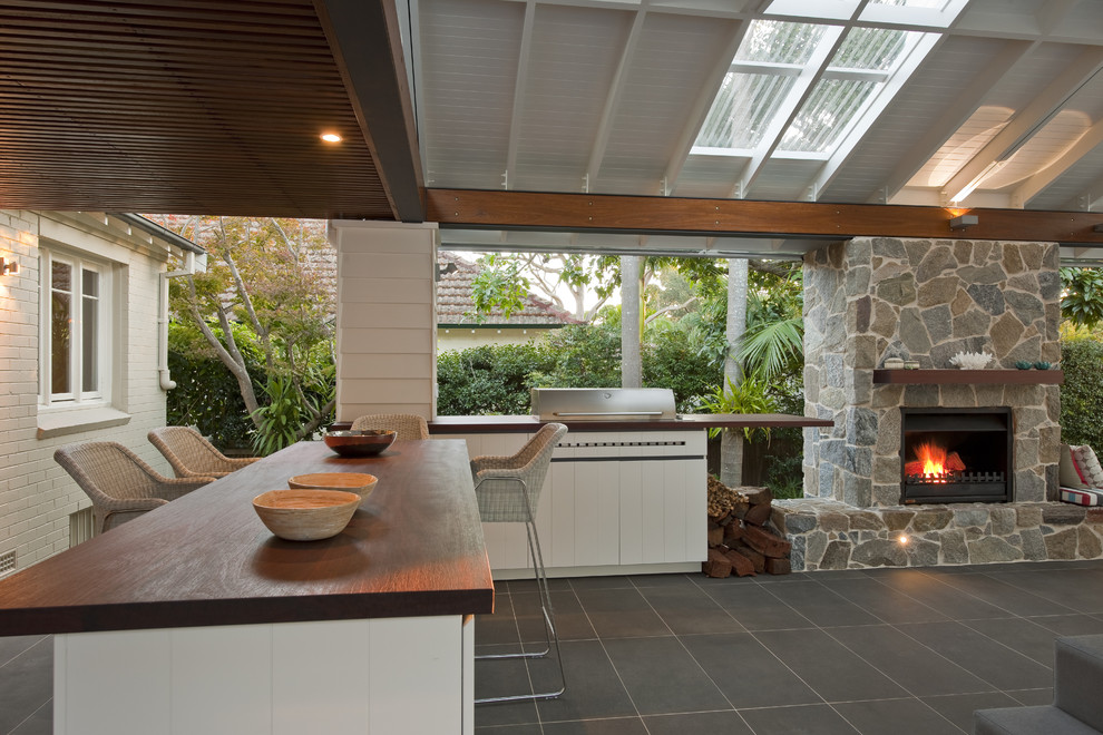 Large contemporary backyard patio in Sydney with a pergola.
