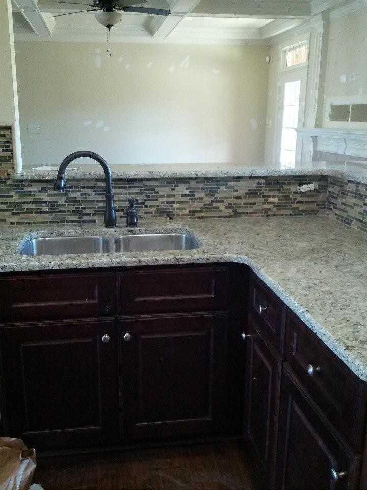 Kitchen - transitional kitchen idea in Raleigh with granite countertops, multicolored backsplash and matchstick tile backsplash