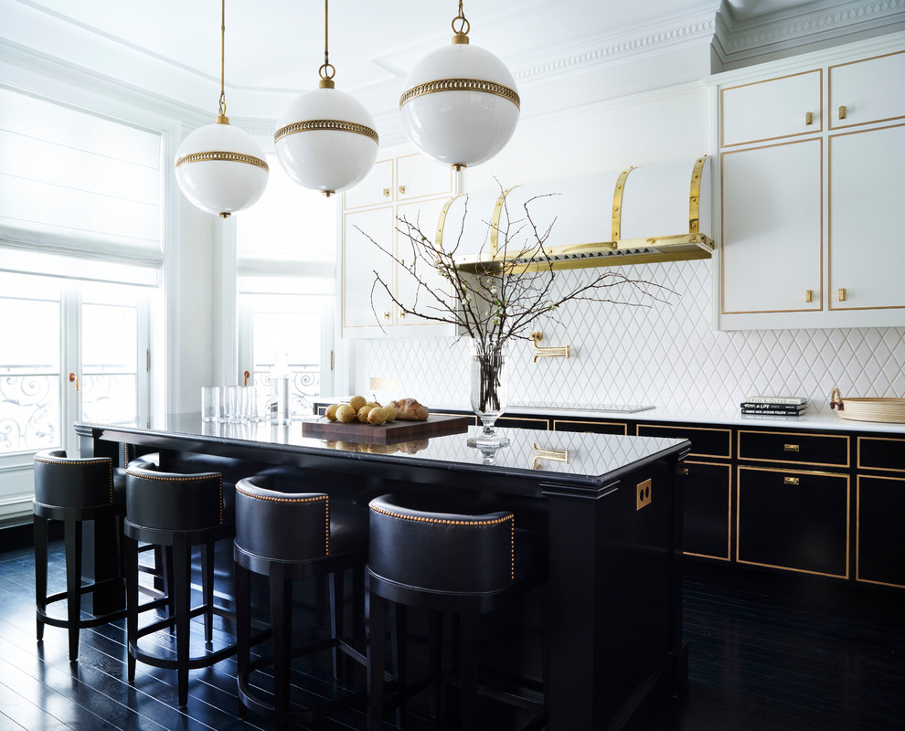 This is an example of a traditional kitchen in Moscow with white splashback, with island and black floor.