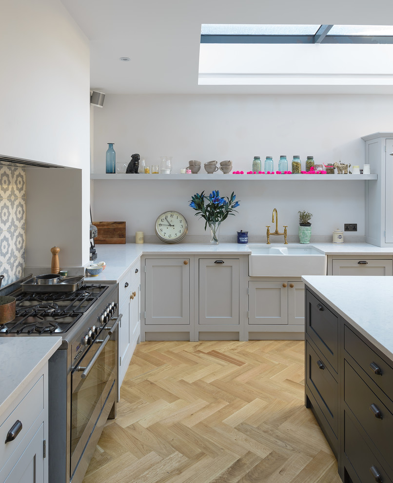 This is an example of a mid-sized country kitchen in London.