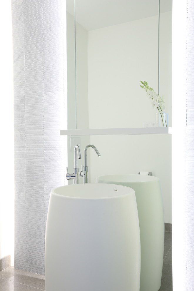 Inspiration for a large contemporary 3/4 bathroom in Vancouver with white walls and a pedestal sink.