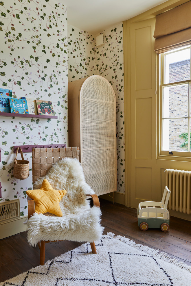 Design ideas for a medium sized traditional gender neutral nursery in London with white walls, dark hardwood flooring and brown floors.
